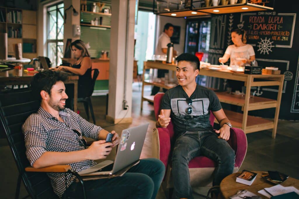 image of two friends working